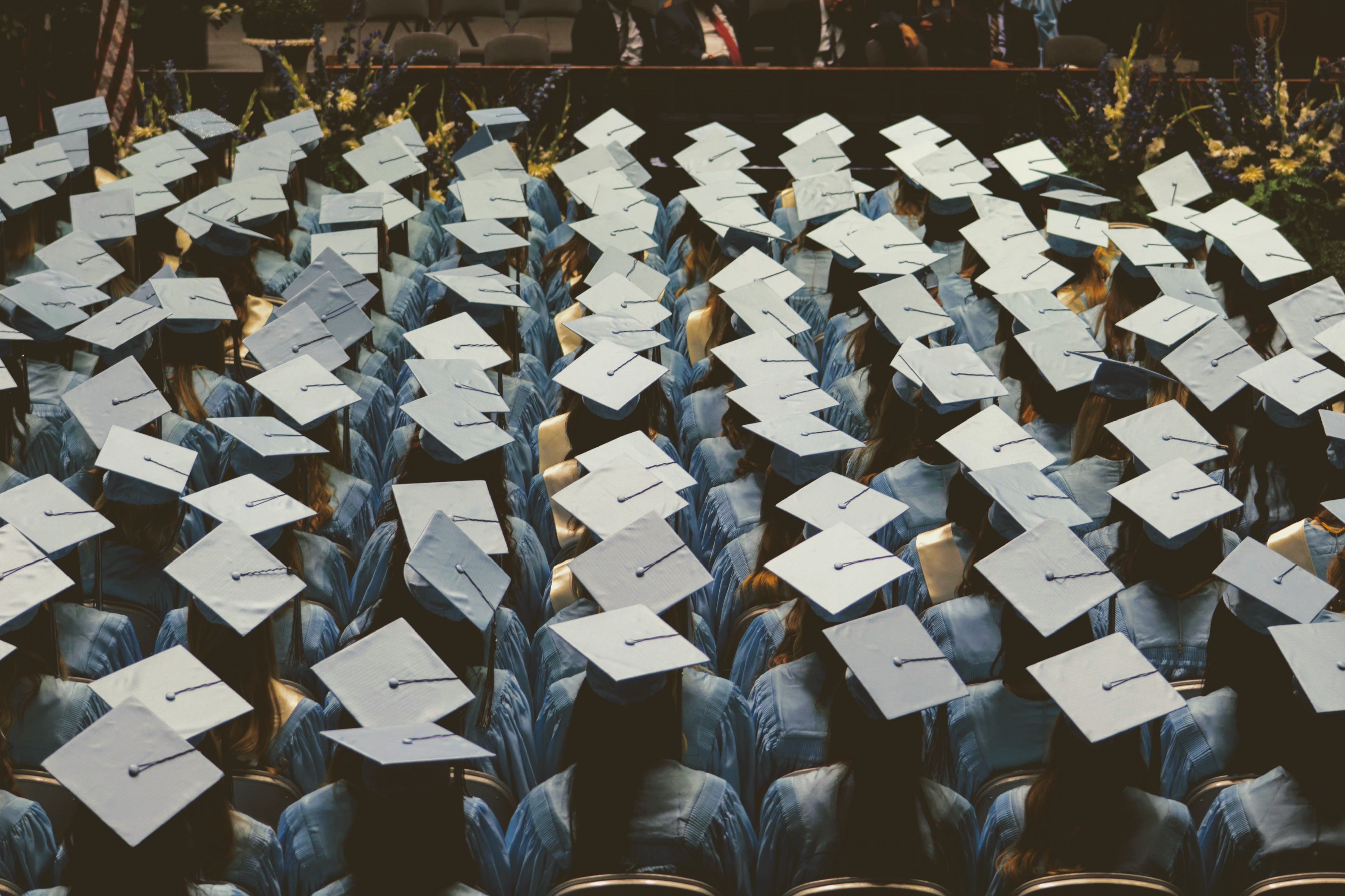 Photograph of university graduates sitting at their commencement ceremony